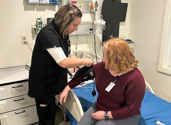 Elizabeth Martin taking blood pressure. 