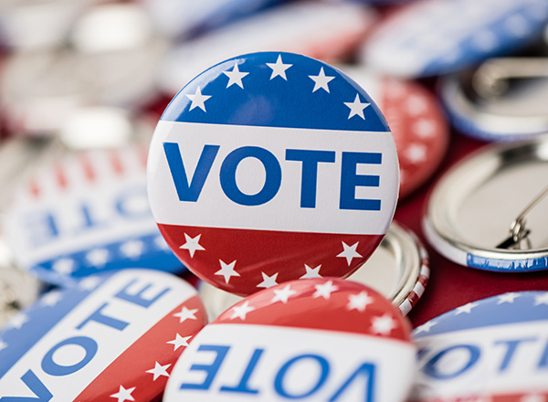 A pile of buttons that read "VOTE"