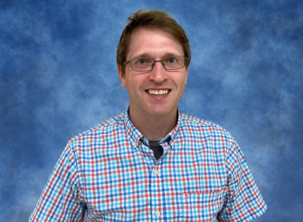 Headshot of Casey Andrews.