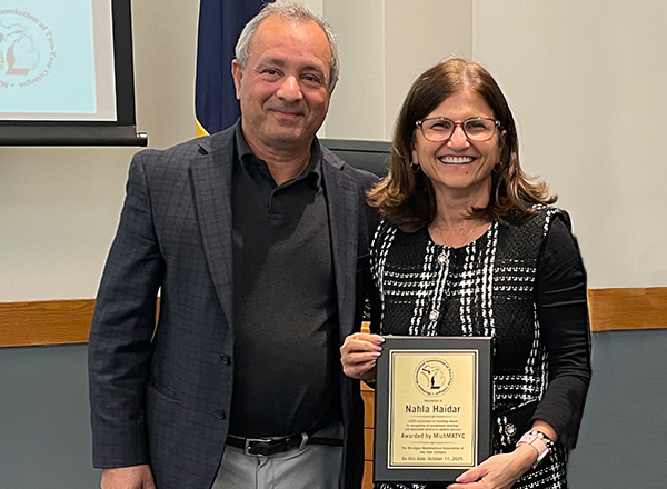 Sam Bazzi left, and Nahla Haider on the right, holding her award. 