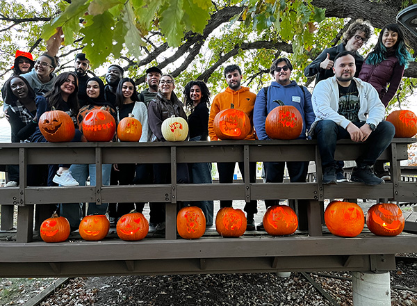 International students with their finished jack-o-lanterns.