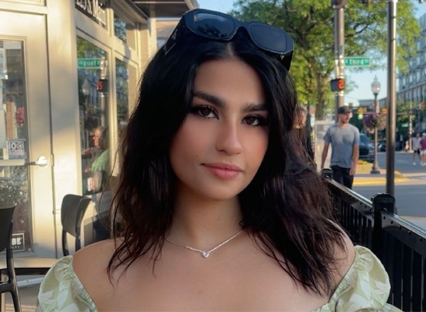 A selfie of Olivia out in a city setting. 