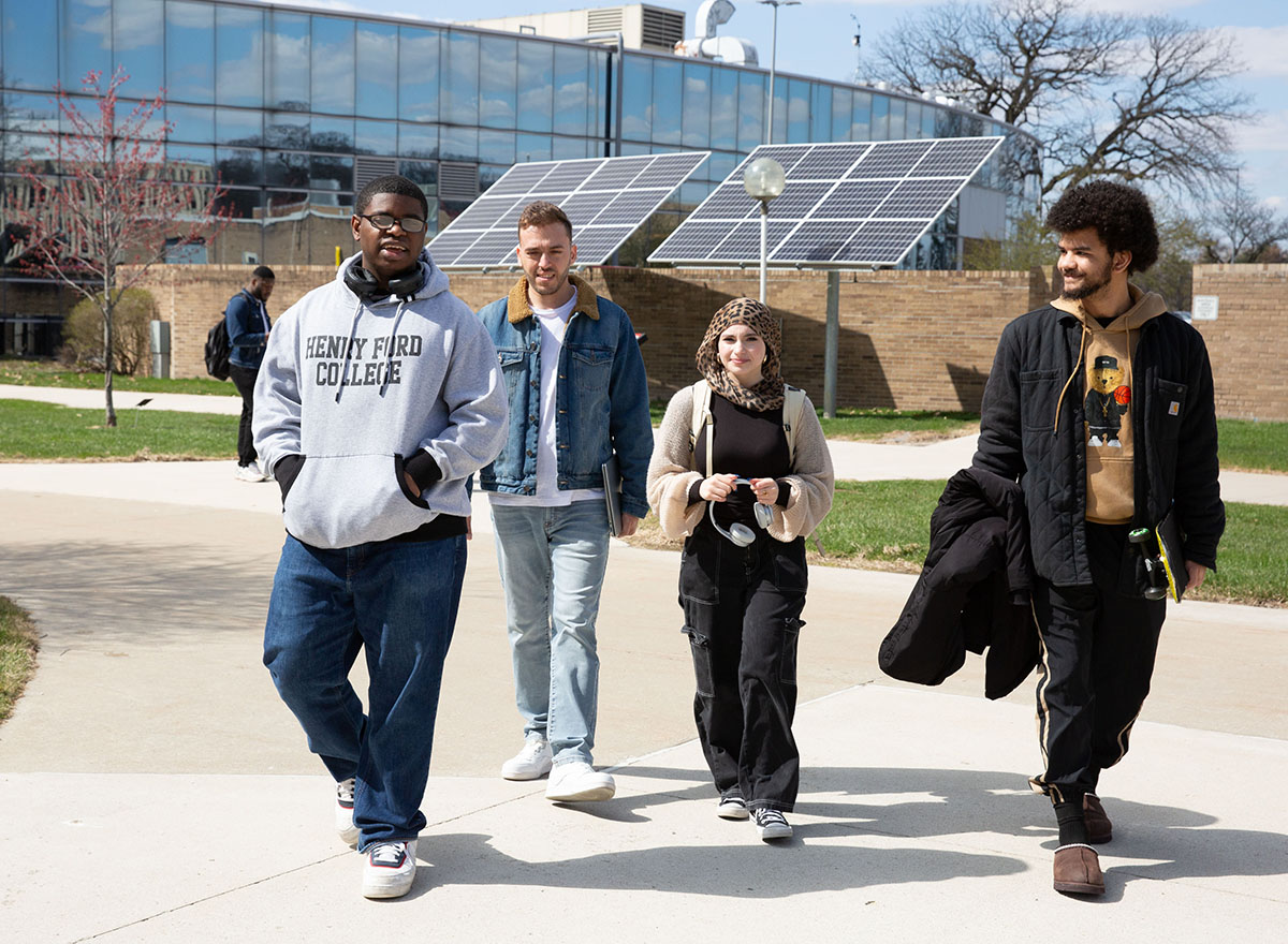 Four HFC students walking together outside