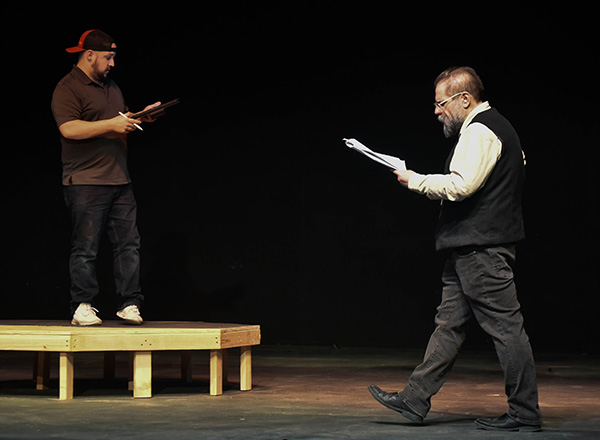 HFC Director of Theatre Dr. John-Michael Sefel (R) discusses a scene in "Freddy, Mabel, & the Pirate King!" with Mike Knight (L) during rehearsal. 