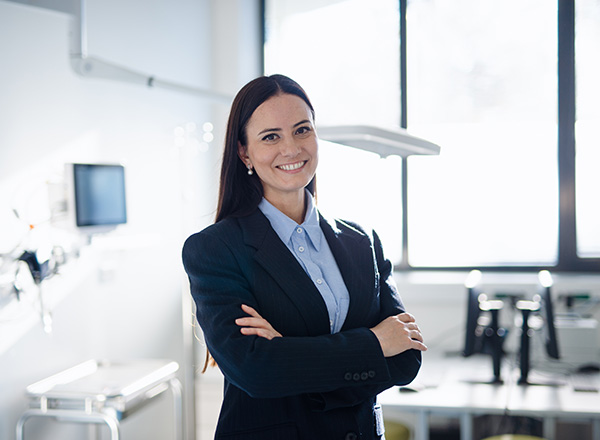 Healthcare administrator in a hospital room.