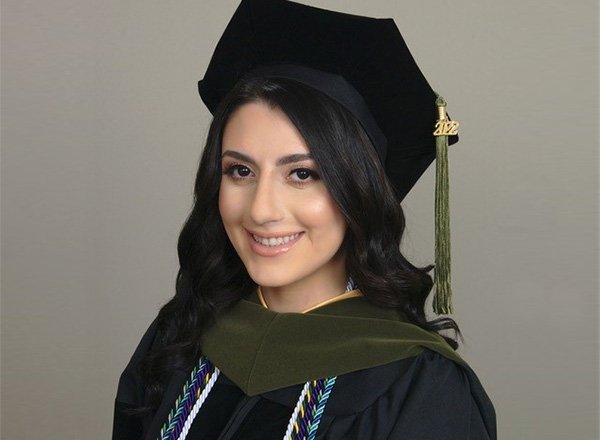 Graduation regalia photograph of Rola Hariri.
