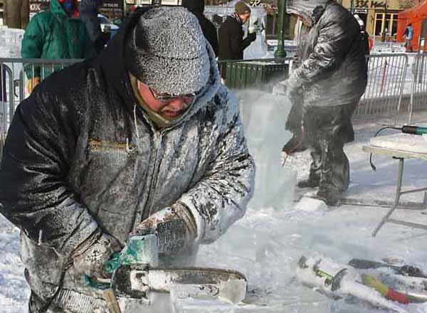 A student works on an ice carving during a competition in 2015. 