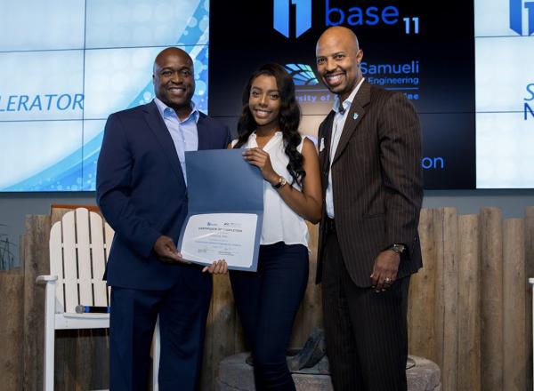 Photo: Breanna Allen, center, receives her certificate of completion for the University of California-Irvine Autonomous Engineering Academy.