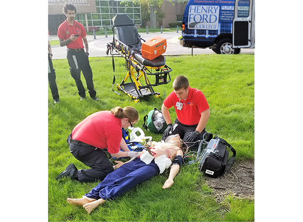 HFC students perform a simulated 911 call with a high-tech patient simulator on campus grounds