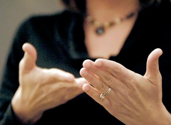 ASL signer's hands while signing