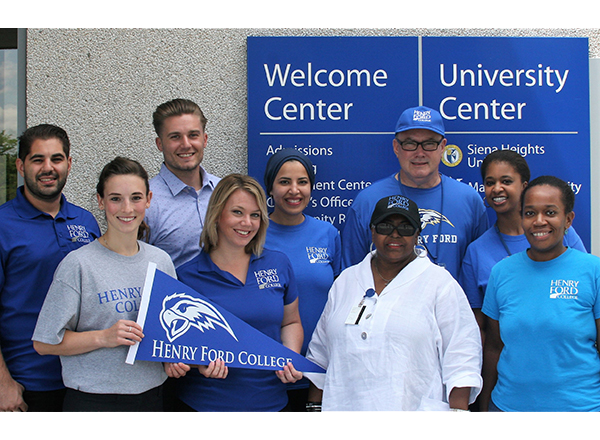 HFC staff wearing and holding HFC gear