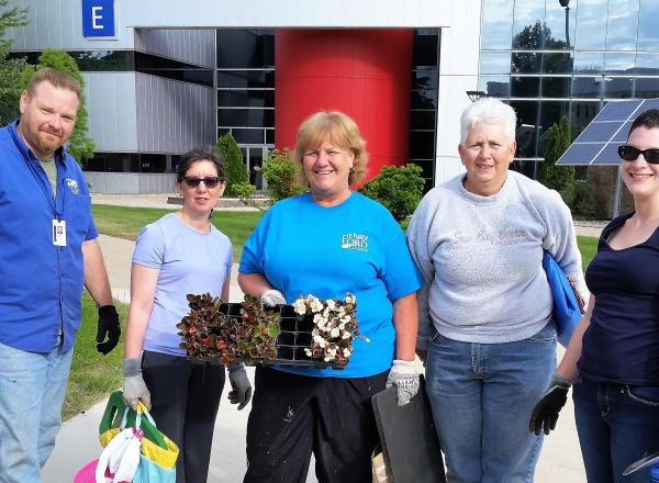5 HFC employees dressed for gardening