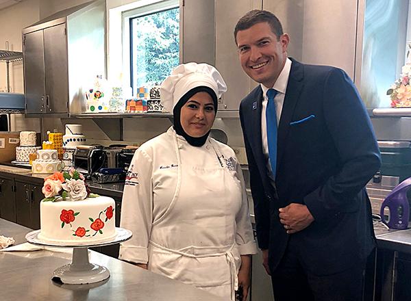 President Kavalhuna meets with a culinary student