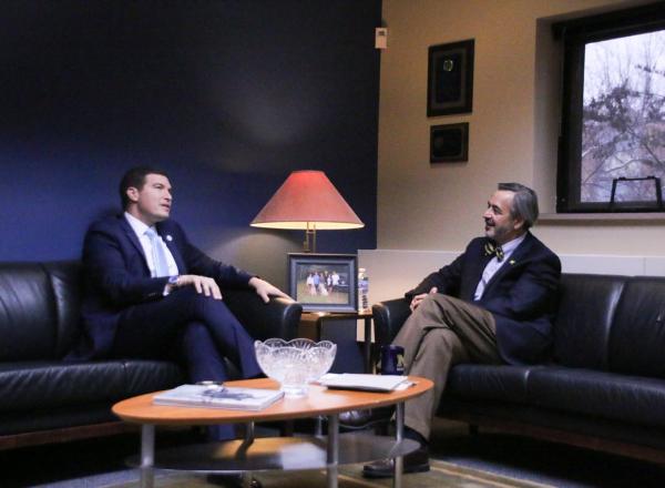 Russell Kavalhuna sitting across from Domenico Grasso