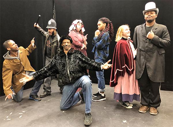 Actors on stage, in costume