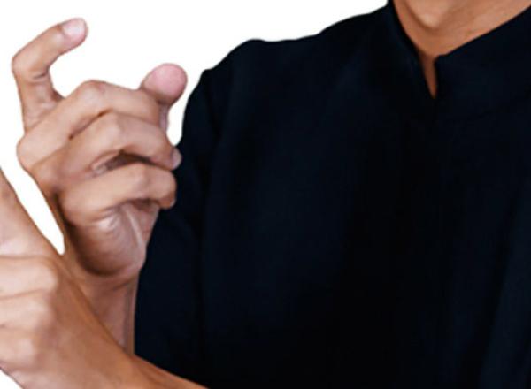 A man using his hands to speak in sign language