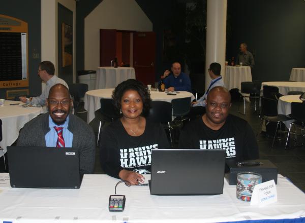 HFC staff members collect funds at the pancake breakfast