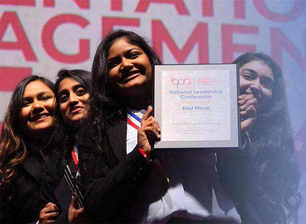 BPA students holding an award