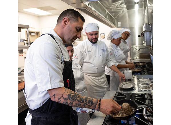 Chef Cosenza in the kitchen with students