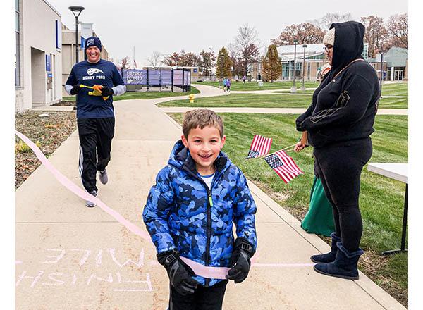 Photo of President Kavalhuna (left) and his son during the Turkey Trot 