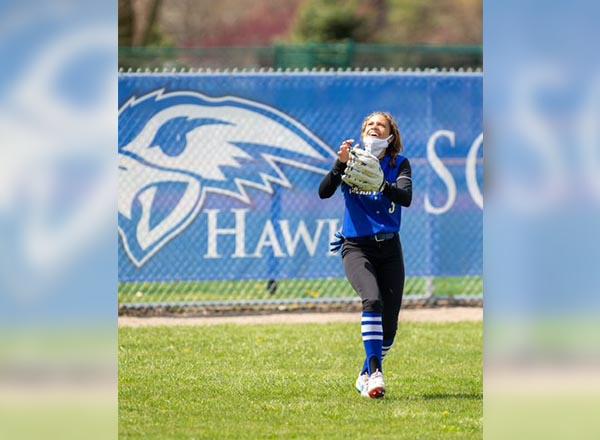 HFC softball player in the outfield.