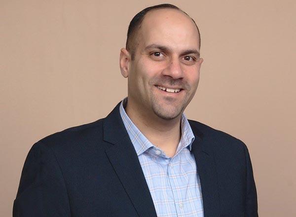 A headshot of Kamel Elkadri.