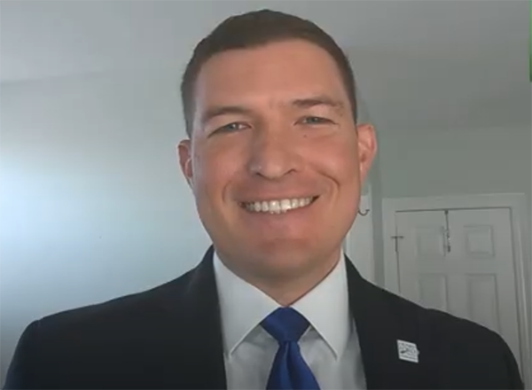 Headshot of Russ Kavalhuna during press conference