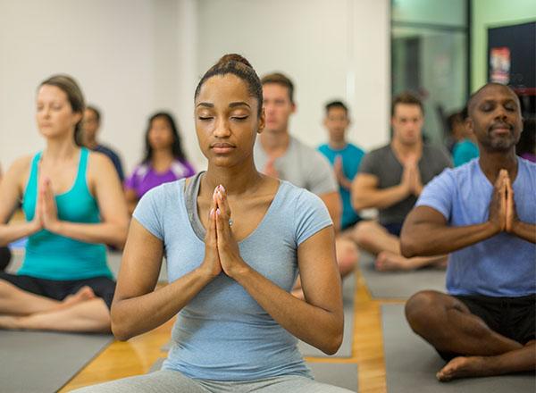 A group of adults practicing yoga