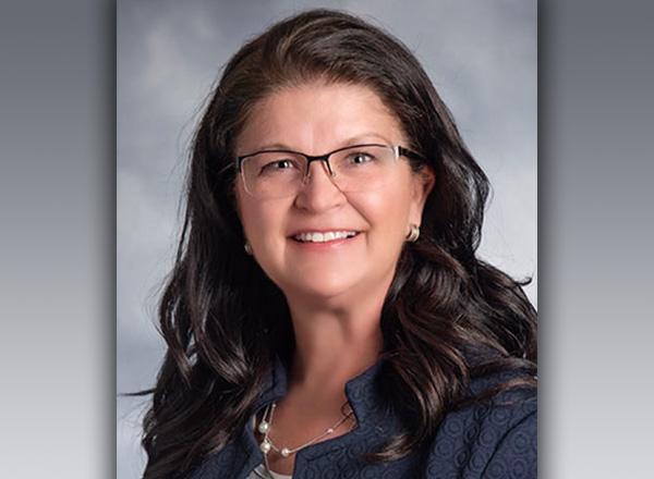 A headshot of Kristine Donahue