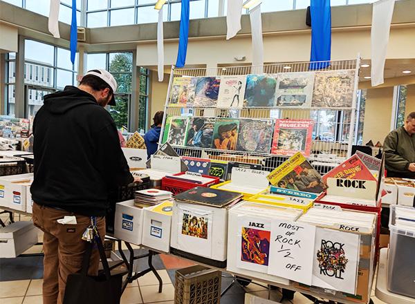 photo of man going through record bins