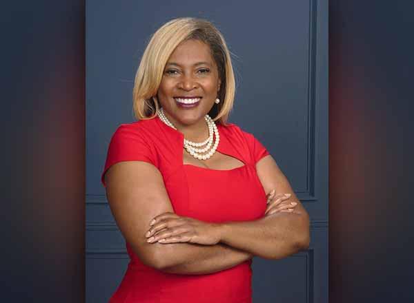 Portrait of Pamela Pugh in a red dress