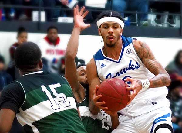 Action photo of Hawks men's basketball player.