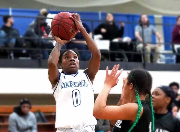 Action photo of a Hawks women's basketball player.