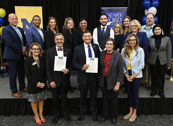 photo of people standing in a group, celebrating