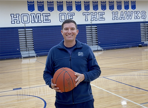 Photo of HFC President Russ Kavalhuna holding a basketball.