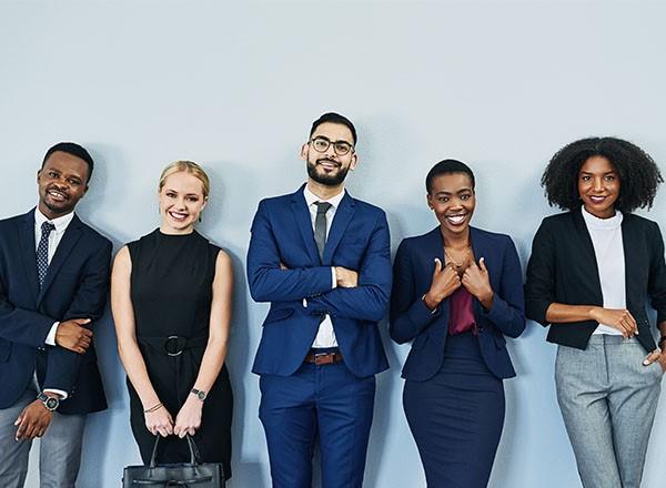 Photo of 5 people in business attire. 
