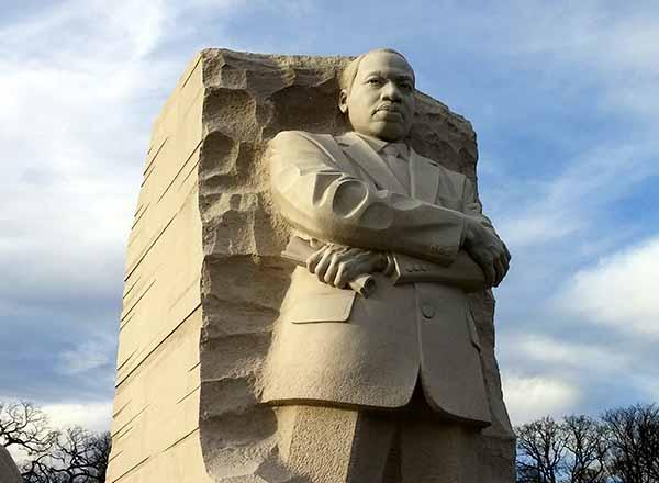 Dr. Martin Luther King, Jr. statue with blue sky in background.