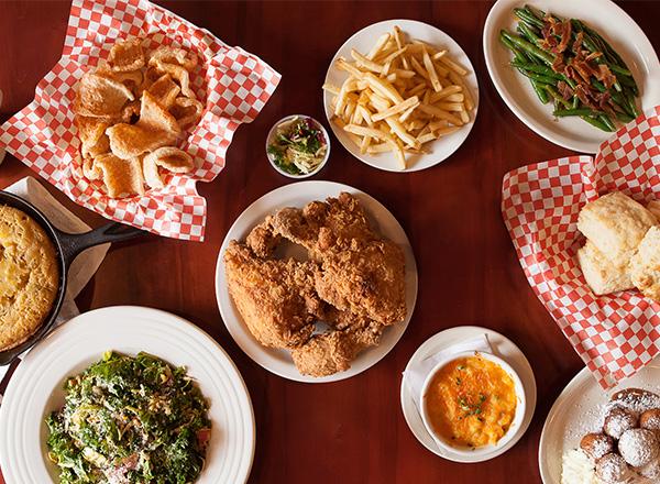 Variety of soul food dishes on a table.