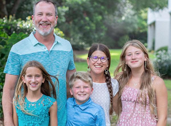 Alison Buchanan surrounded by her family. 