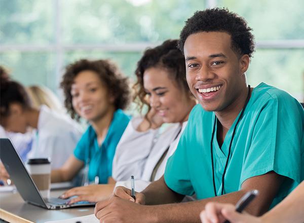Pre-med student smiles during class.