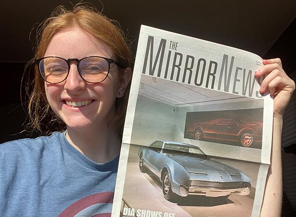 Lillian Grantham holds up an issue of Mirror News