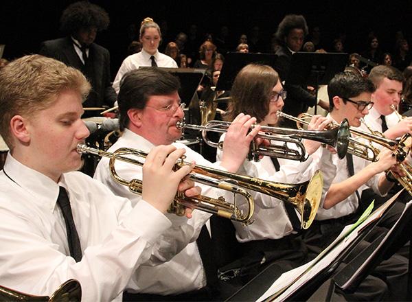 Several students playing musical instruments. 
