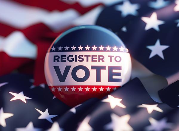 Register to vote button on an American flag.