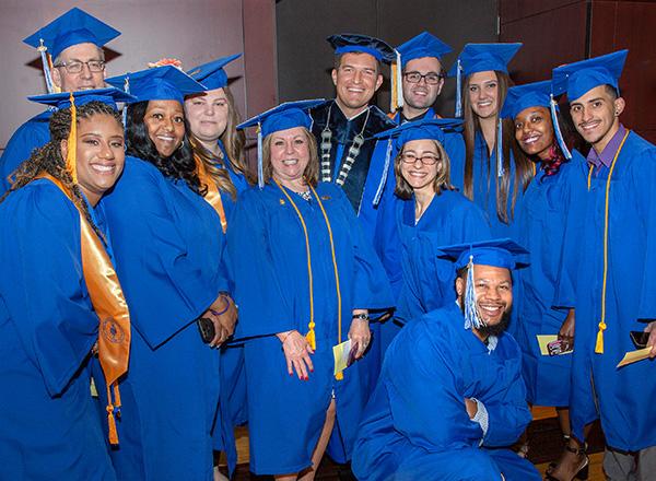 Graduates with HFC President Russ Kavalhuna.