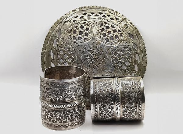 Libyan silver cuffs and brooch.