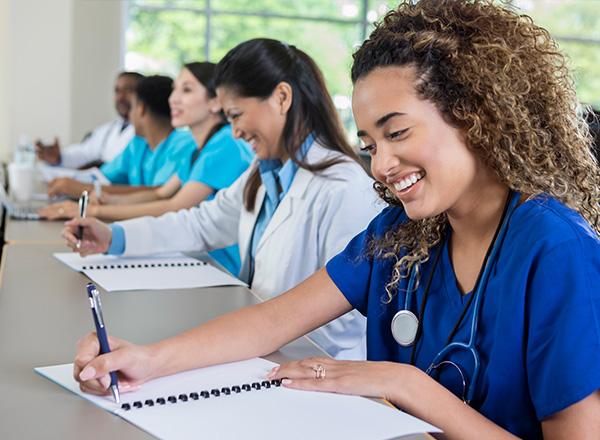 Nursing students taking written tests.
