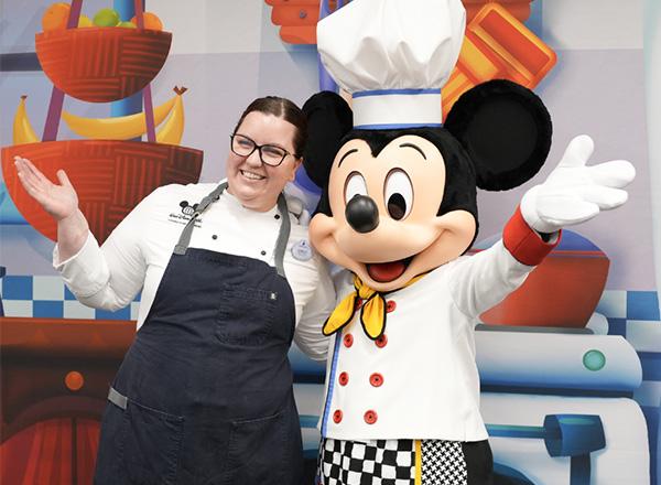 Photo of student chef with Mickey Mouse.
