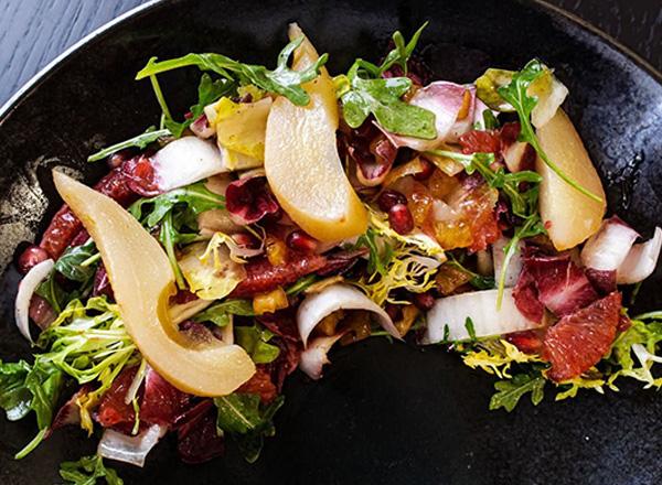 A closeup of the Fifty-One O One's Winter Fruit and Endive Salad.