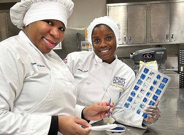 Culinary students making chocolates.