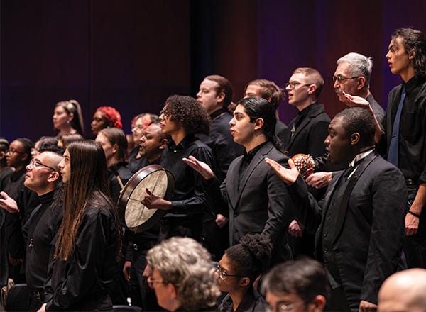 HFC chorus singers singing at a concert.